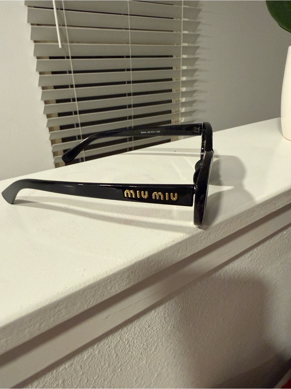 Miu Miu Black Cat-Eye Sunglasses with Dark Lenses
